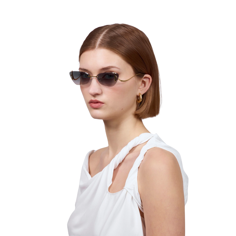 Model wearing FOR ART'S SAKE Crimson Topaz rimless cat-eye sunglasses – modern luxury eyewear
