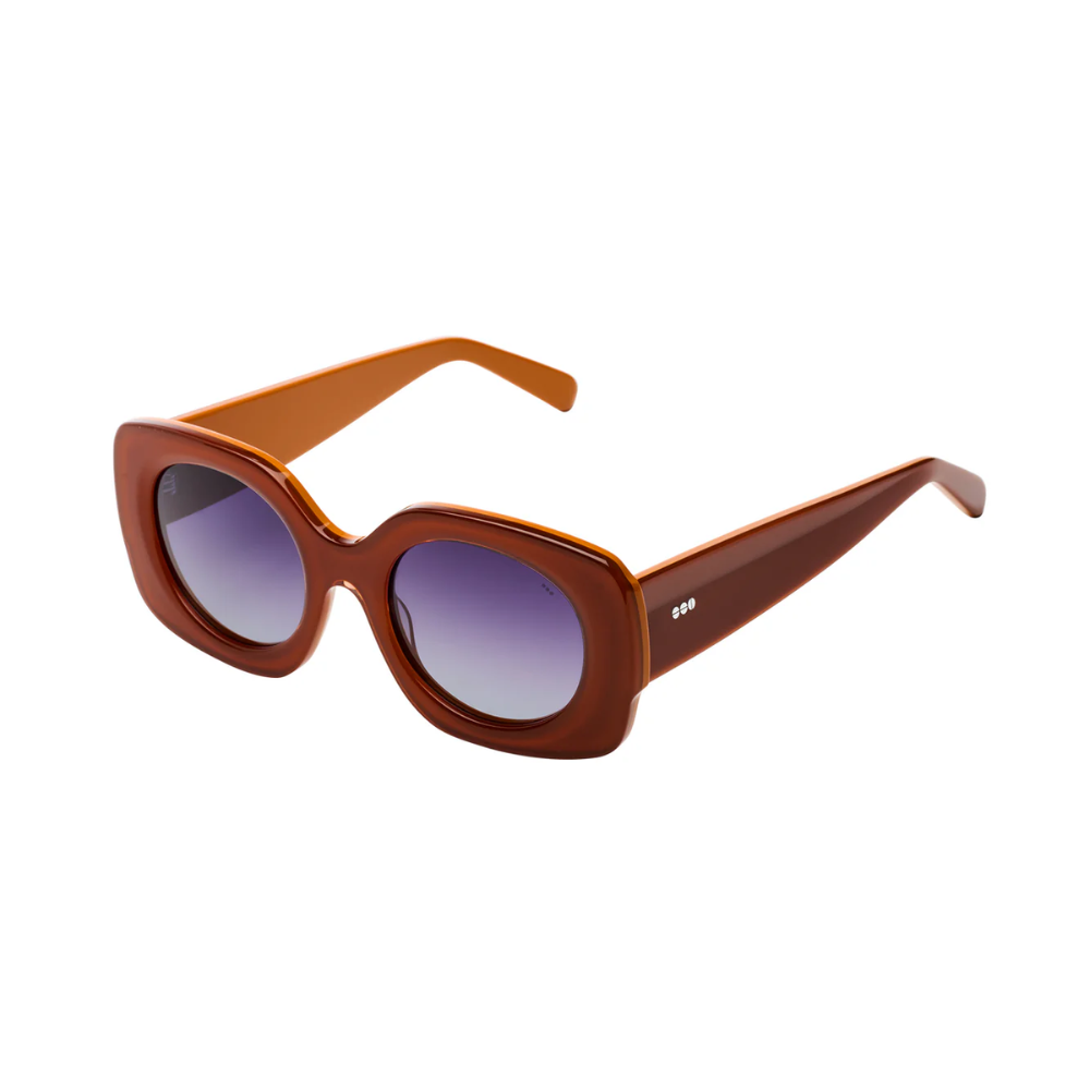 Komono Mariah Amber designer sunglasses - angled view highlighting translucent amber tones and elegant style
