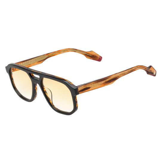 Woodys x Queen Champions 02 sunglasses – three-quarter view showing guitar-engraved metal core and laminated end-pieces
