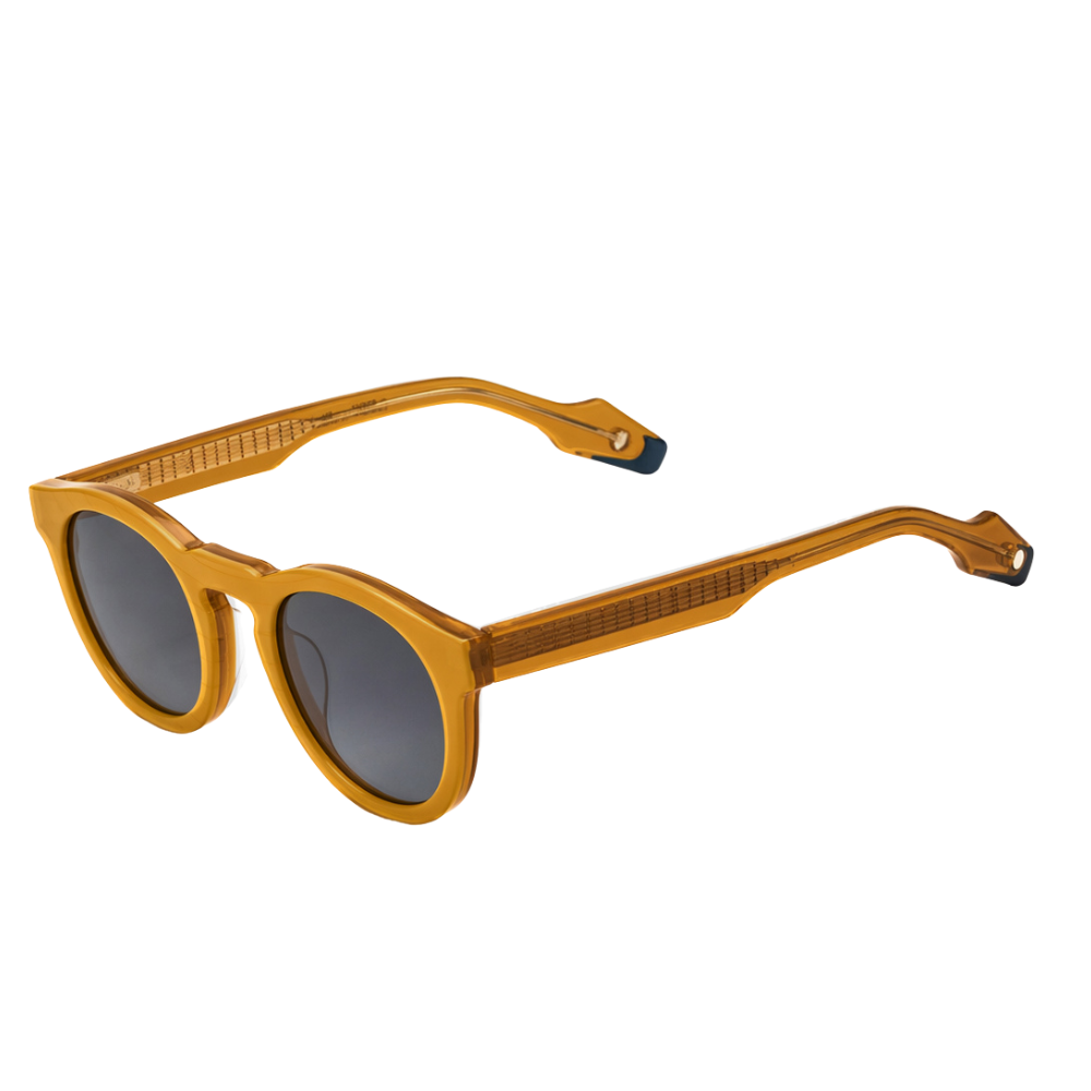 Woodys x Queen Radio C2 sunglasses – three-quarter view showing guitar-engraved metal core and laminated end-pieces
