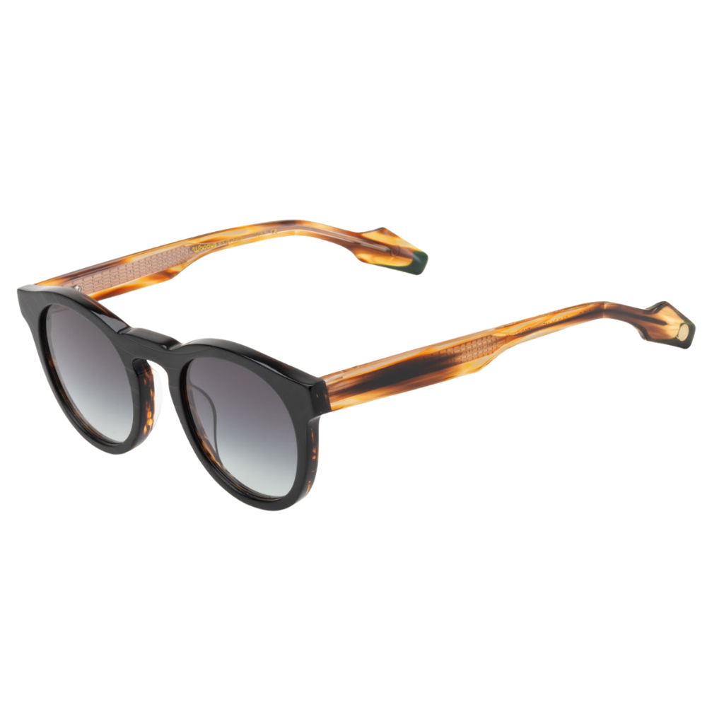 Woodys x Queen Radio C1 sunglasses – three-quarter view showing guitar-engraved metal core and laminated end-pieces
