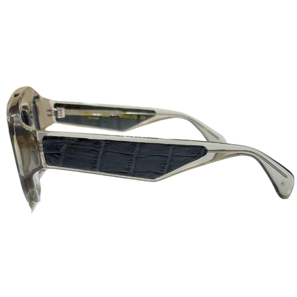 Detail of high-gloss Italian acetate and crocodile leather contrast on Clarissa Oliverio Michelangelo frames
