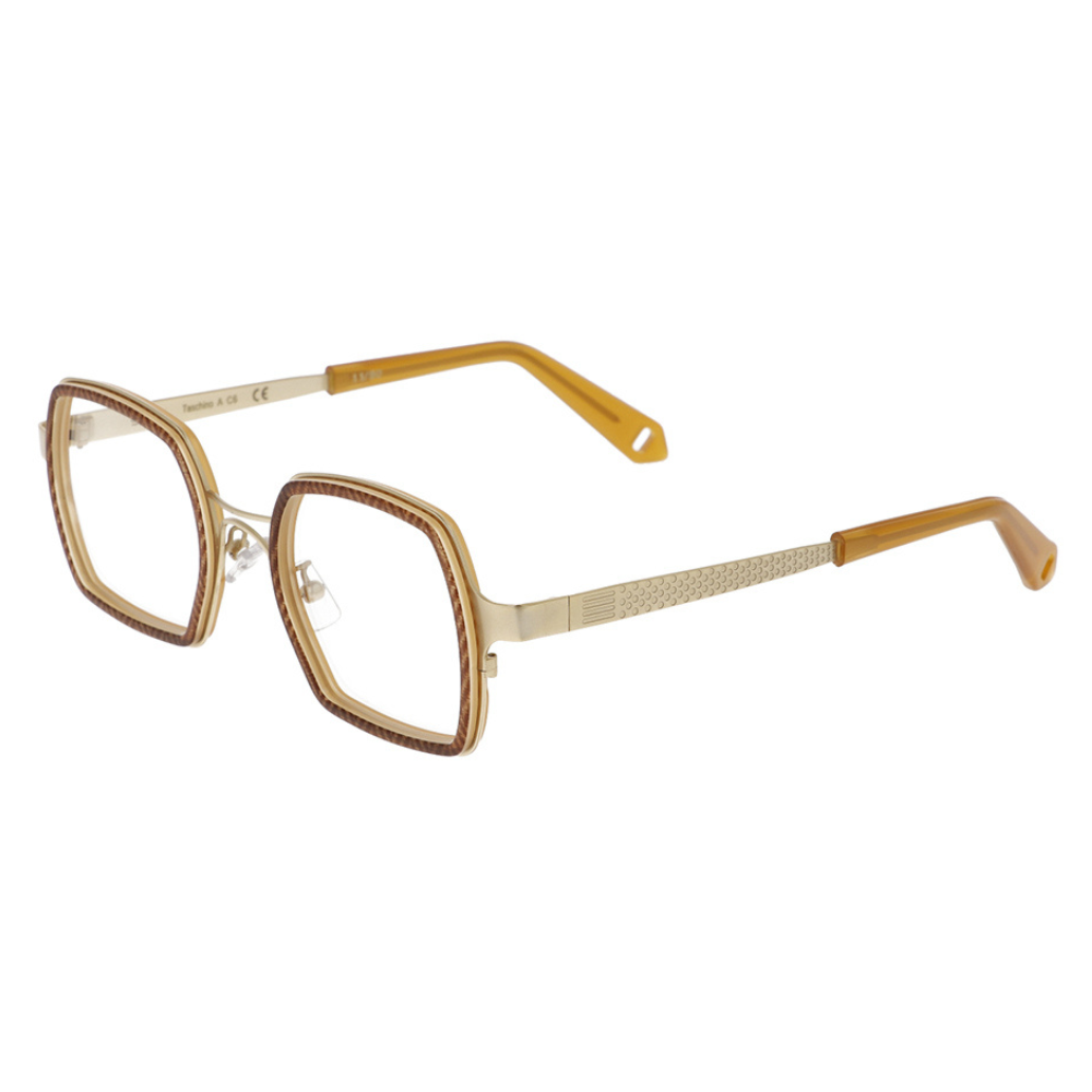 GOOD'S Taschino A C6 — Limited edition optical frame in bio-acetate and gold stainless steel, three-quarter side view showing the tie-shaped temple with thimble detail and amber acetate tip, handmade in Italy
