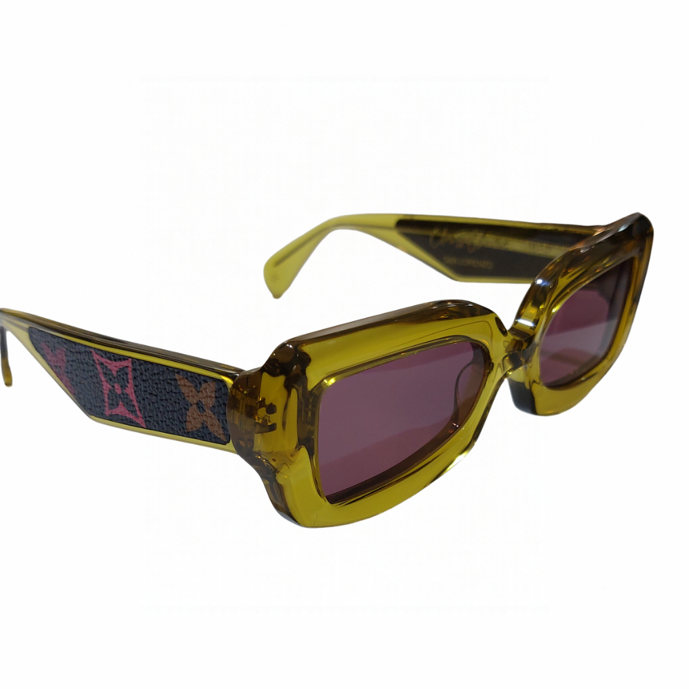 Clarissa Oliverio San Lorenzo Mash-Up LV sunglasses, three-quarter view with translucent yellow acetate, purple lenses and monogram leather temple inserts.
