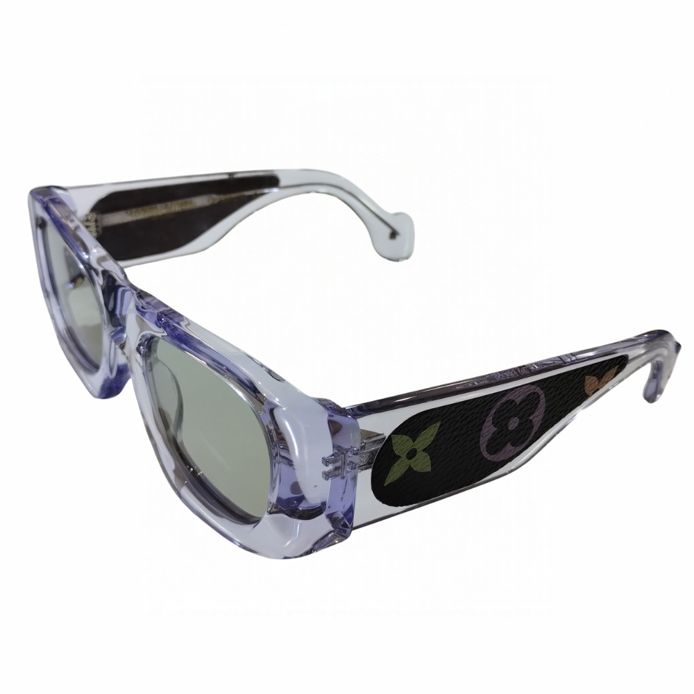 Clarissa Oliverio Mash-Up No. 02 sunglasses, three-quarter view showing grey lenses, sculpted translucent acetate and floral monogram leather detailing.

